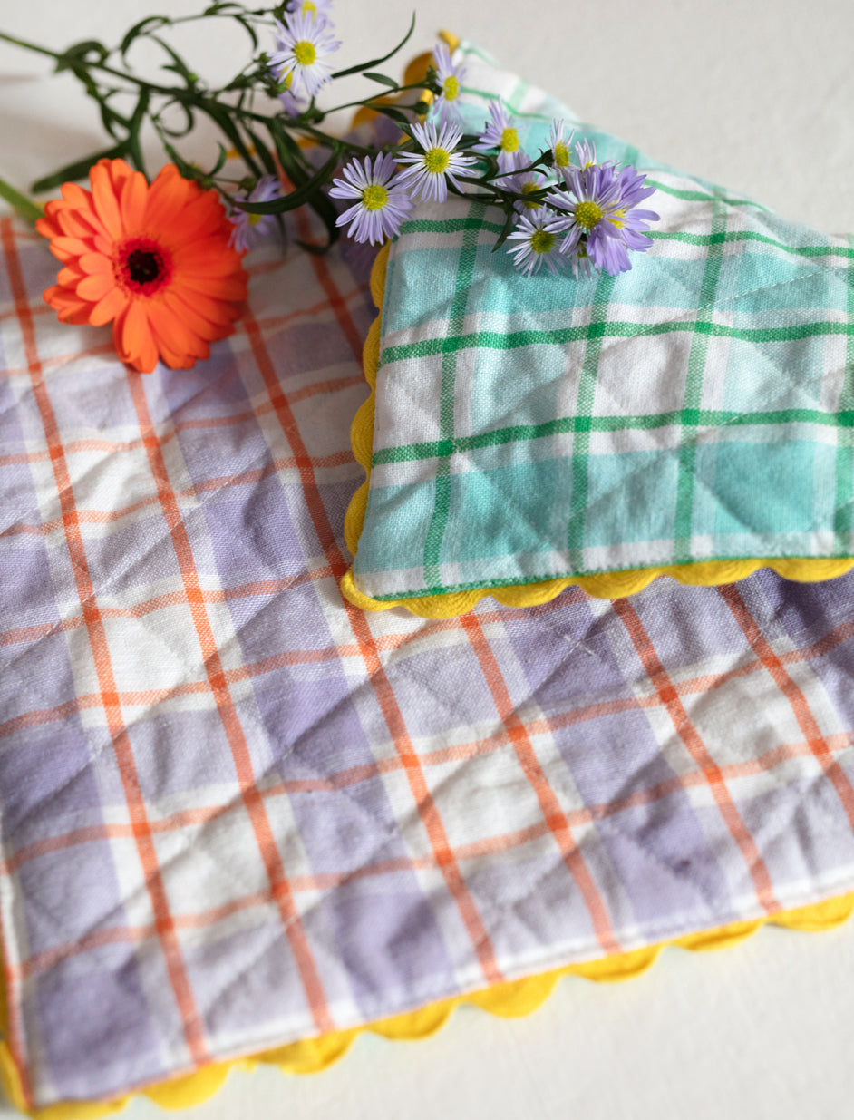 A Pair of Aqua and Orchid Reversible Placemats