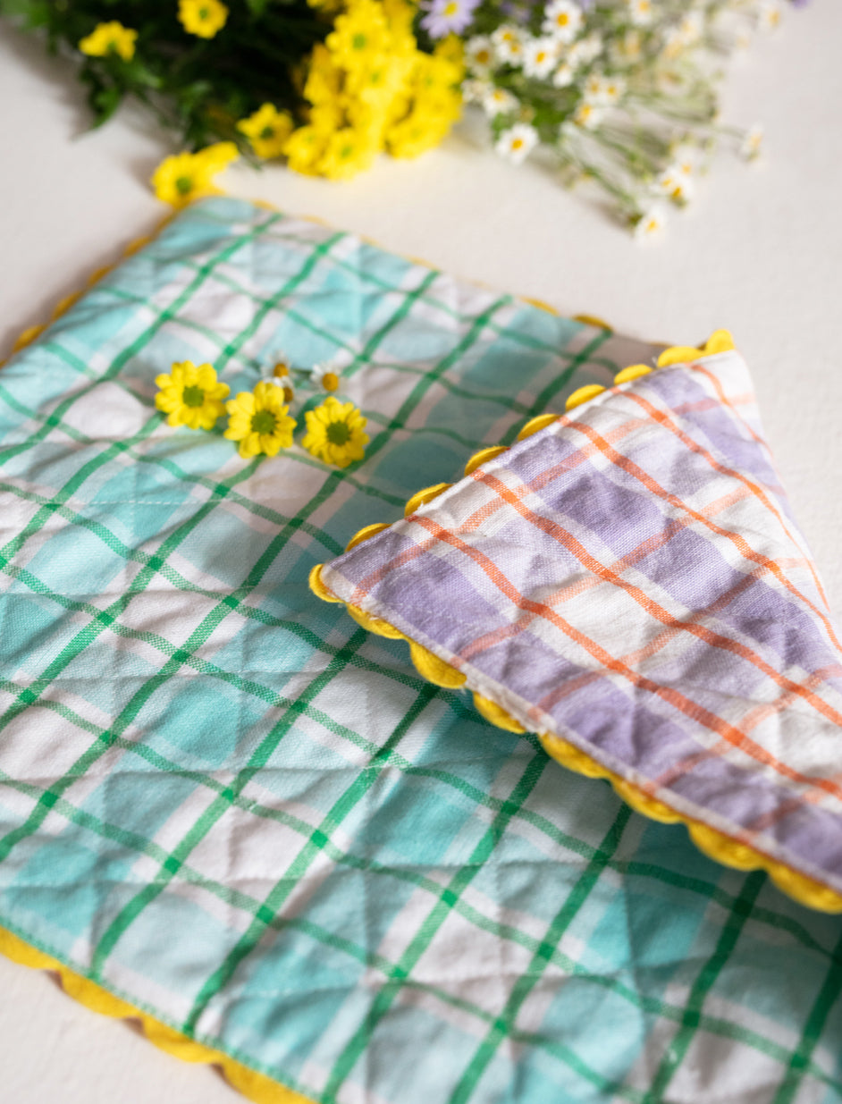 A Pair of Aqua and Orchid Reversible Placemats