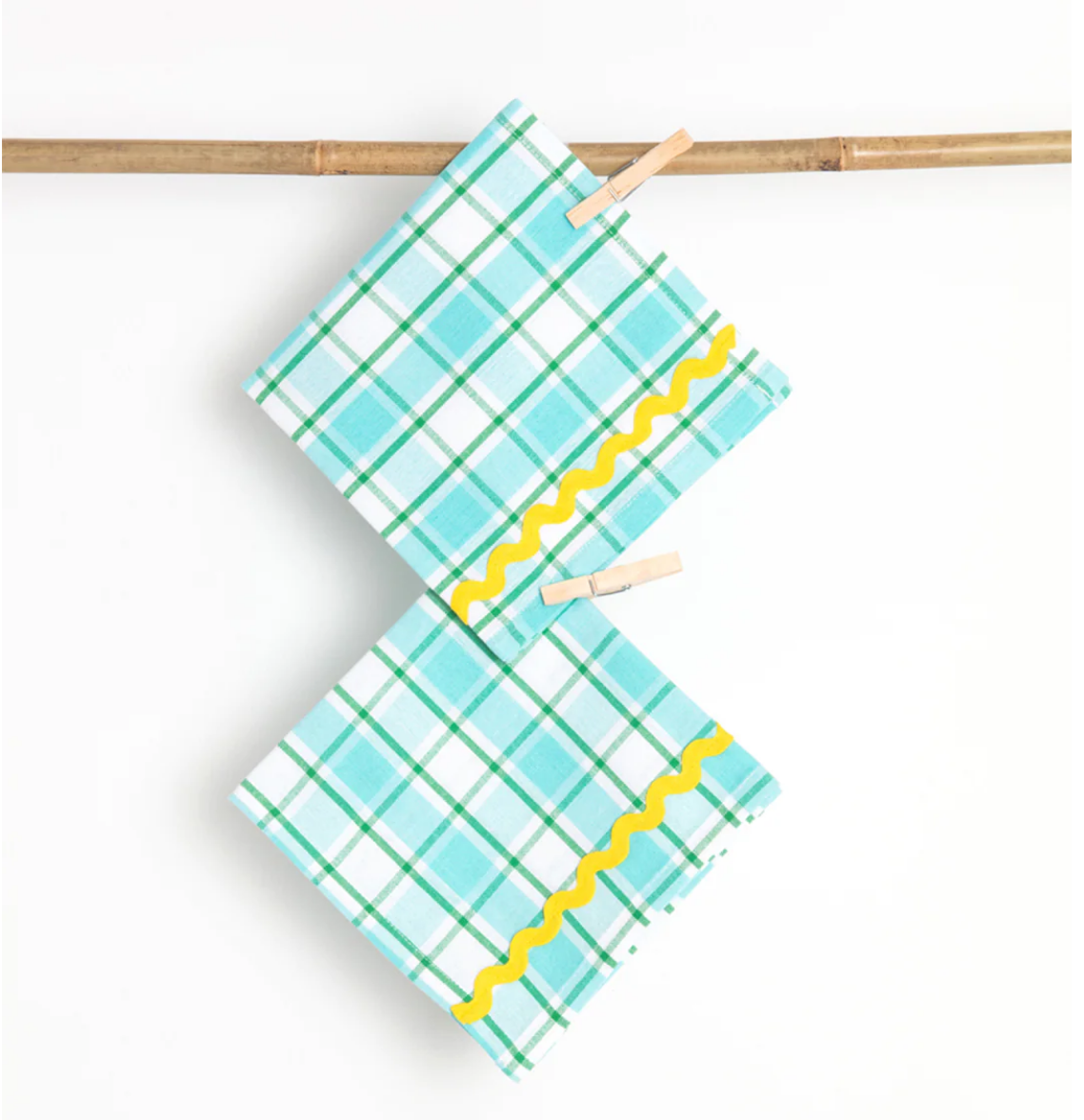 A Pair of Aqua and Yellow Napkins